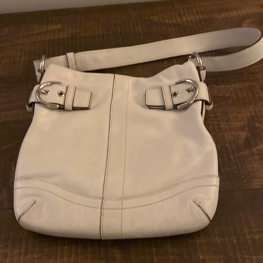 Small beige coach crossbody. Used.